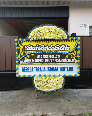 Papan Bunga Duka di Yakomi